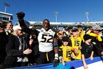 Michael Sam of the Missouri Tigers celebrates with fans after the game against the Kentucky Wildcats at Commonwealth Stadium on Nov. 9, 2013 in Lexington, Kentucky