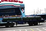 An Iranian military truck carries a Bavar-373 air defence missile system past a portrait of Iran's supreme leader, Ali Khamenei during the Army Day parade in Tehran on April 18. Photographer: Behrouz Mehri/AFP/Getty Images
