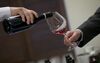 A sommelier pours a glass of Burgundy during a wine tasting in the Hong Kong Wine Vault in Hong Kong, China, on Thursday, July 14, 2011. After Hong Kong axed wine duties in February 2008, imports surged to $858 million last year, from $185 million in 2007.