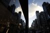 Buildings are reflected in the window of a store in the Ginza area of Tokyo, Japan, on Tuesday, Aug. 21, 2018. Japan is scheduled to release February's Consumer Price Index (CPI) figures on Aug. 23.