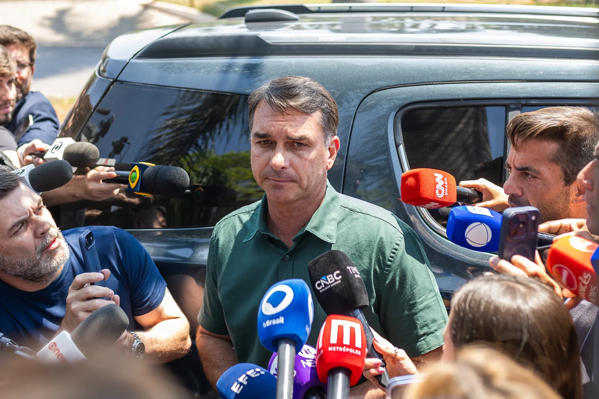 Flavio Bolsonaro speaks to members of the media after visiting his father, Jair Bolsonaro, not pictured, in Brasilia on Oct. 13