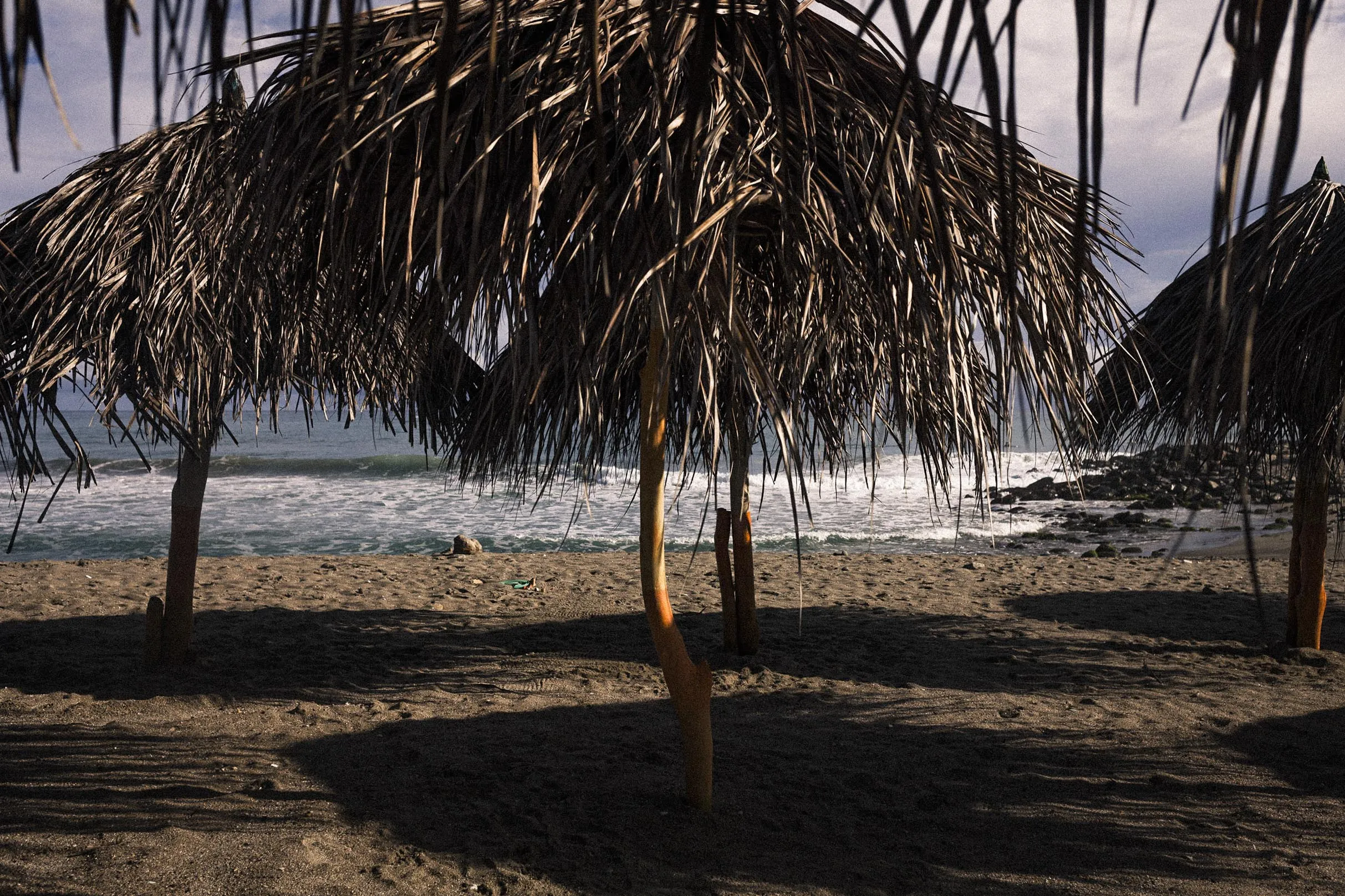 Palm umbrellas at a beach in La Guaira.