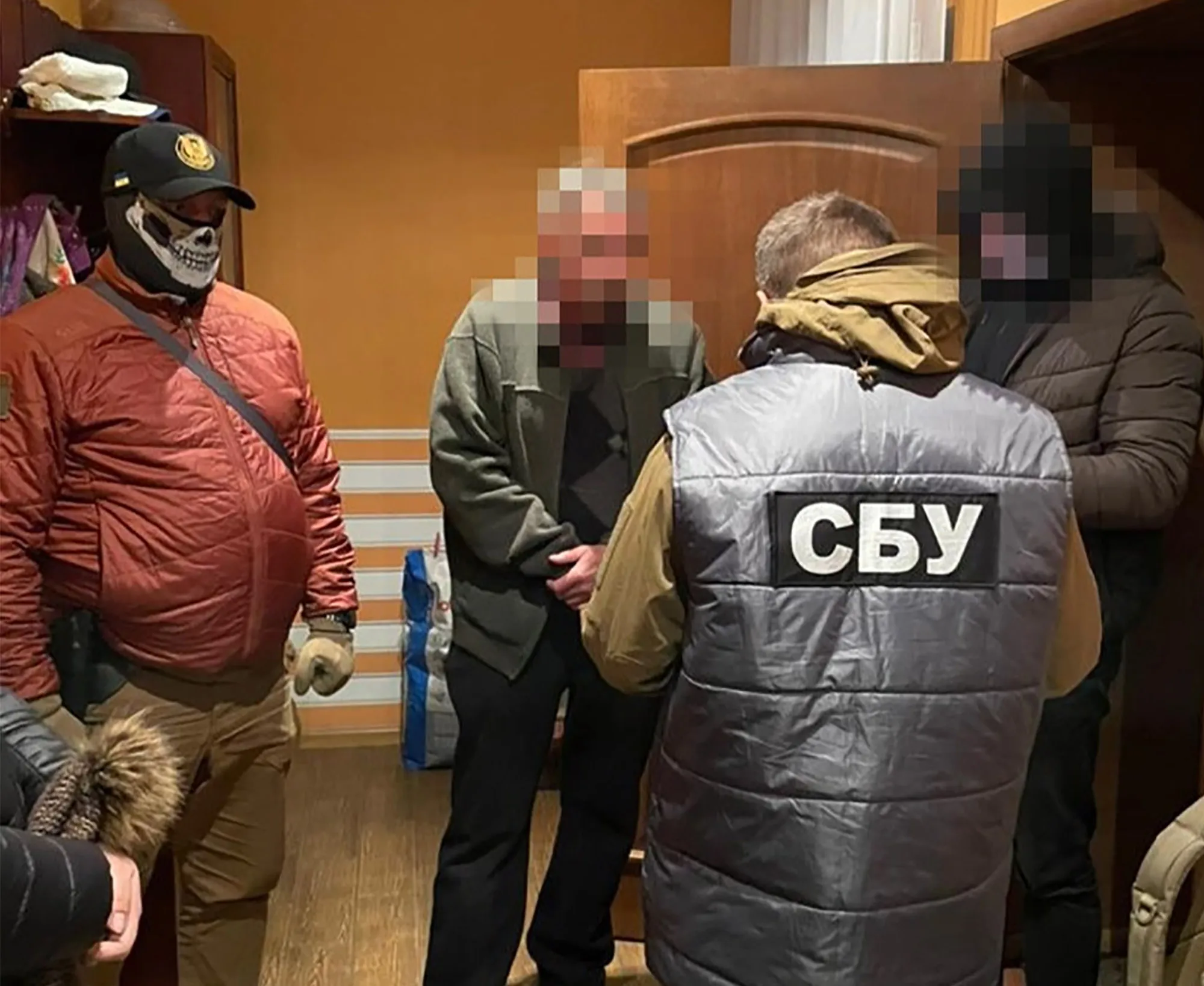An unidentified person is shown during a raid by Ukraine’s security services. 