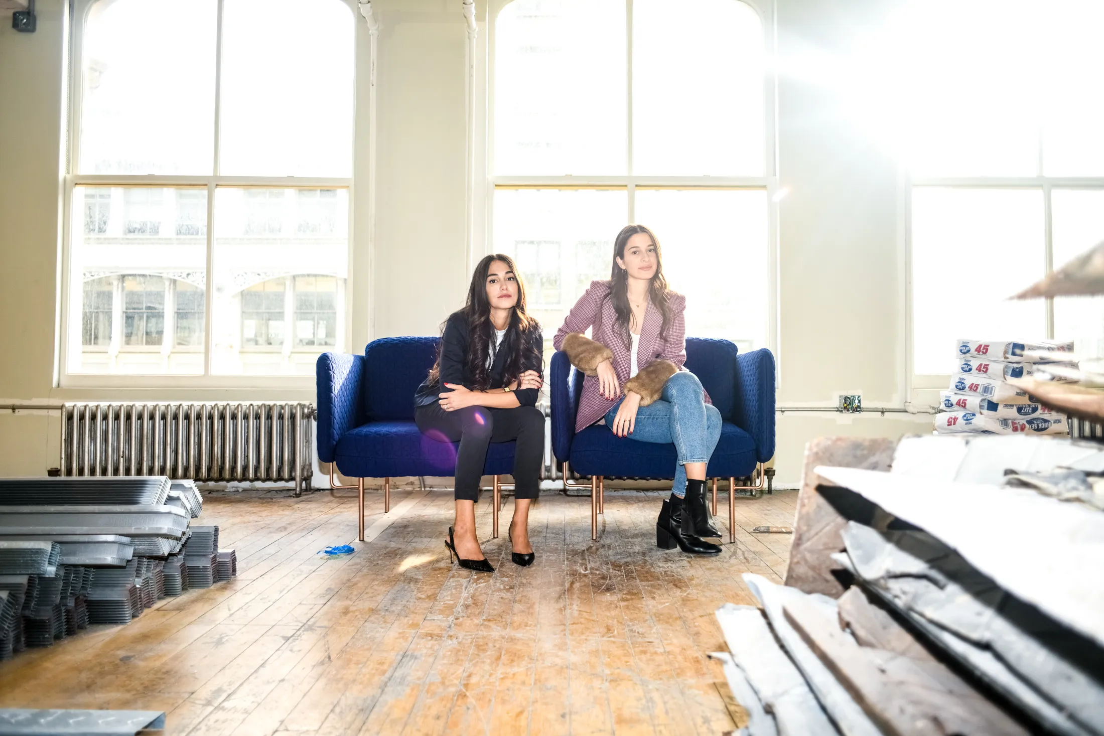 Audrey Gelman and Lauren Kassan amid the construction of an addition to their Wing SoHo co-working space.