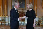King Charles and Liz Truss. He can’t just fire her, in case you’re wondering.