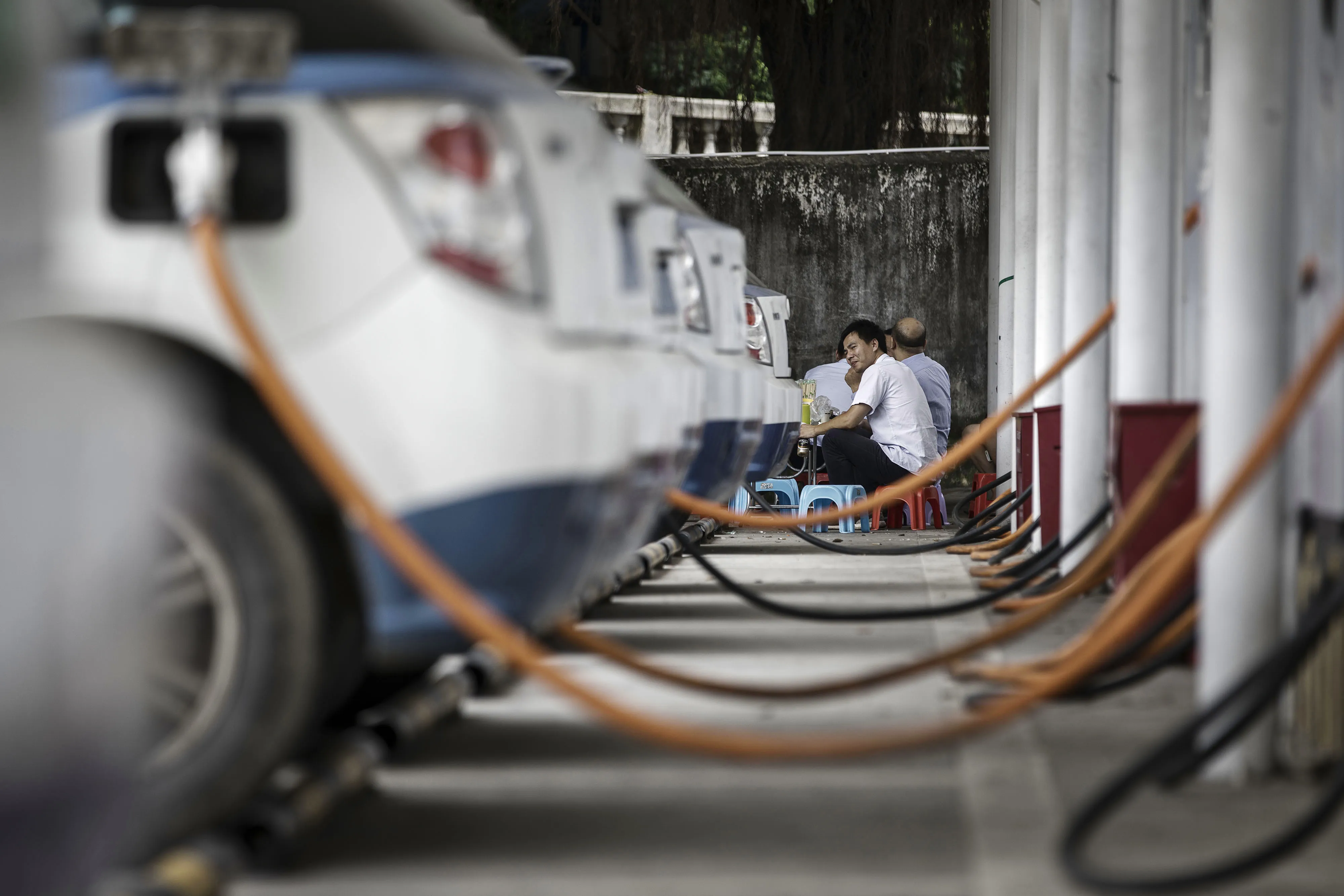 A row of BYD E6 electric taxis charging in Shenzhen.
