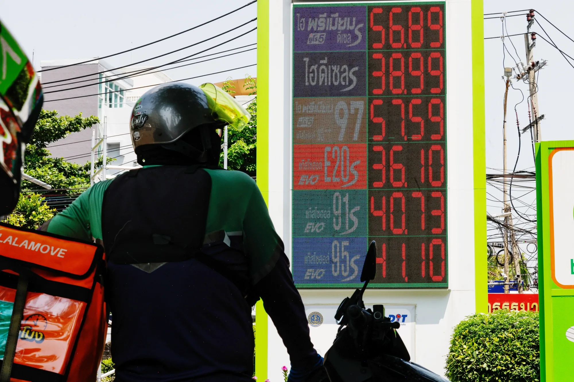 Fuel prices displayed at a Bangchak Corp. petrol station in Bangkok, on March 26.