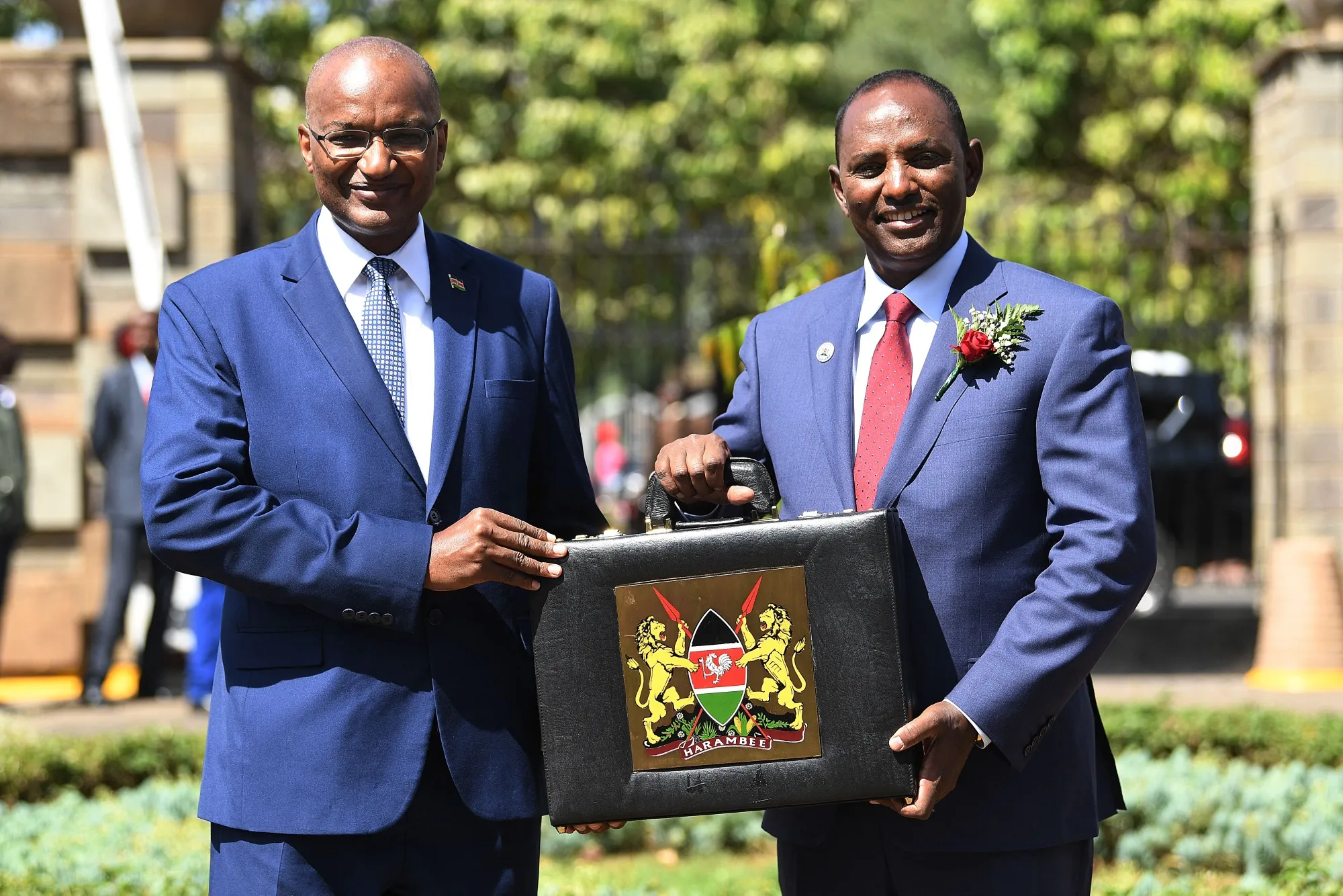 Treasury Secretary Ukur Yatani&nbsp;and Central Bank Governor Patrick Njoronge hold up a briefcase containing the Government's Budget for the 2022/23 fiscal year.