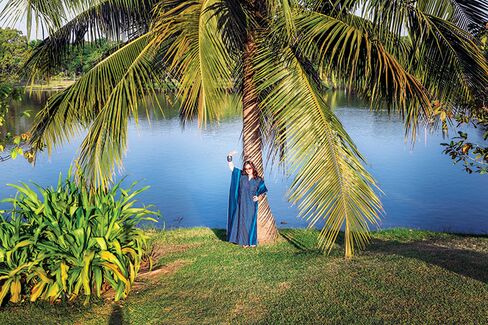 The author—in a caftan—in Bangkok’s Wachira Benchathat Park.