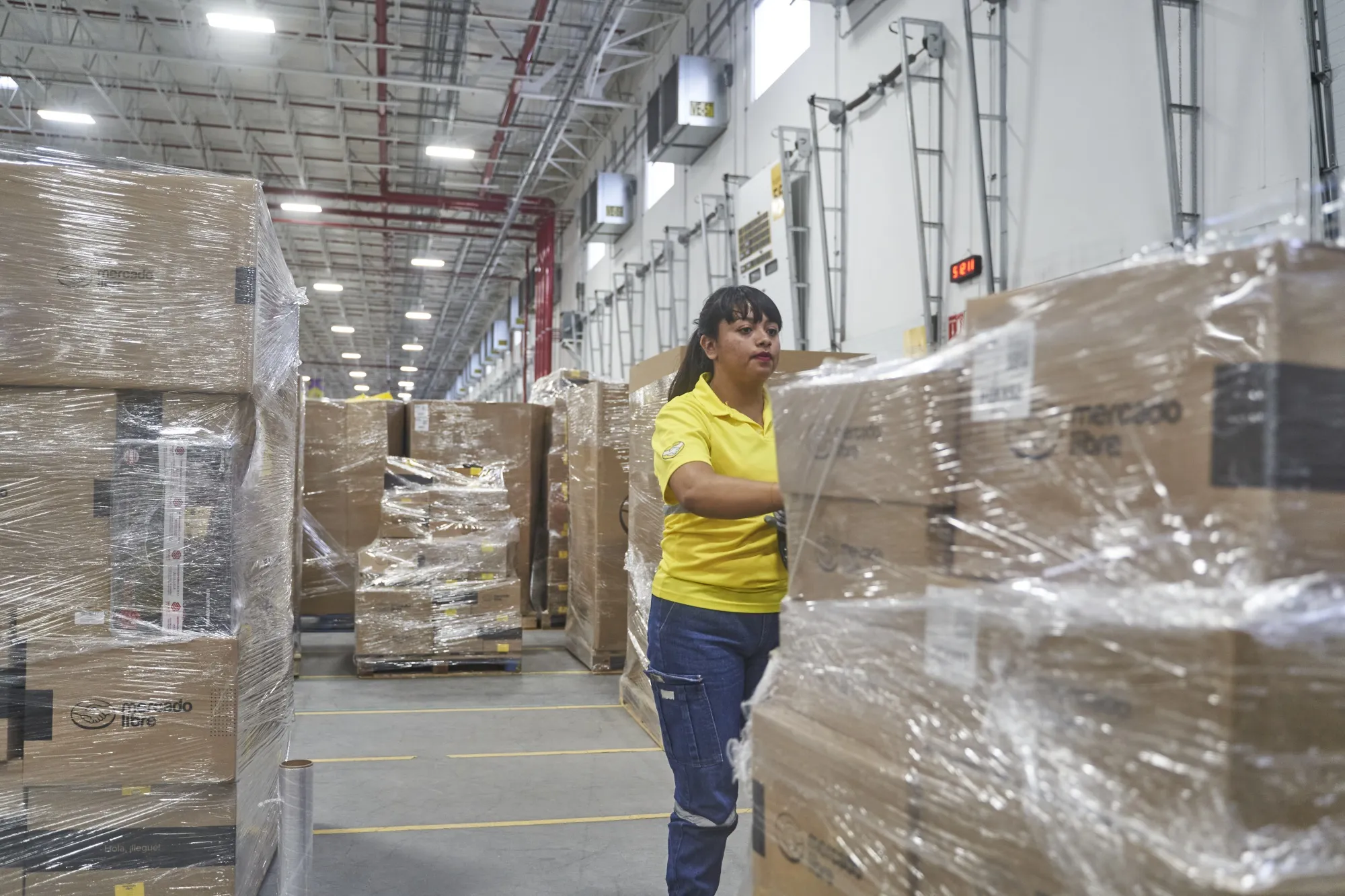 A worker prepares a shipment of goods at the MercadoLibre Distribution Center (Cedis) at Prologis Park Grande in Tepotzotlan, Mexico state, Mexico, on Tuesday, Nov. 29, 2022.&nbsp;