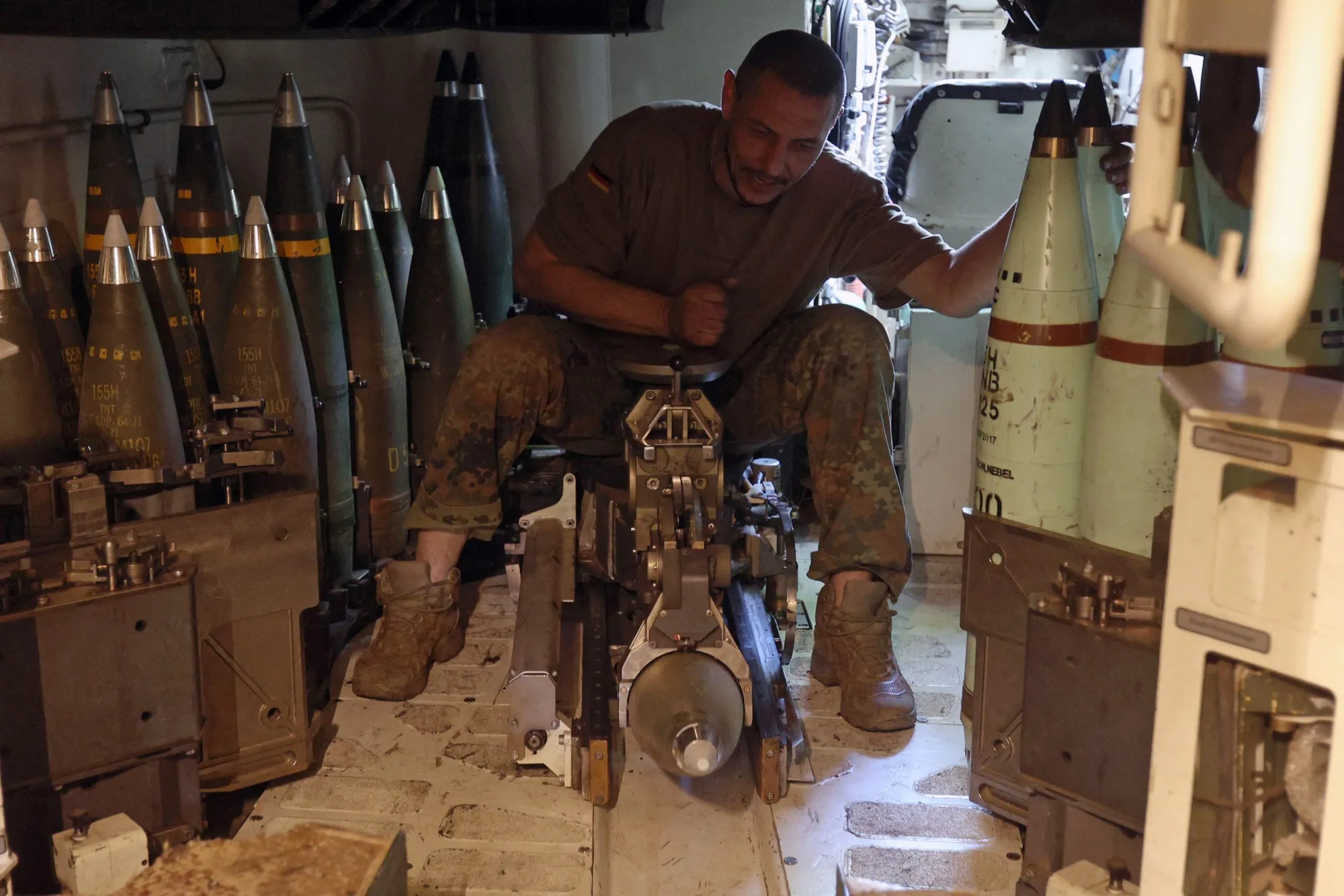 A Ukrainian serviceman of the 43rd Artillery Brigade works inside a 155 mm self-propelled howitzer Panzerhaubitze 2000, toward Russian positions at a front line near Bakhmut, in the Donetsk region on June 15, 2023.