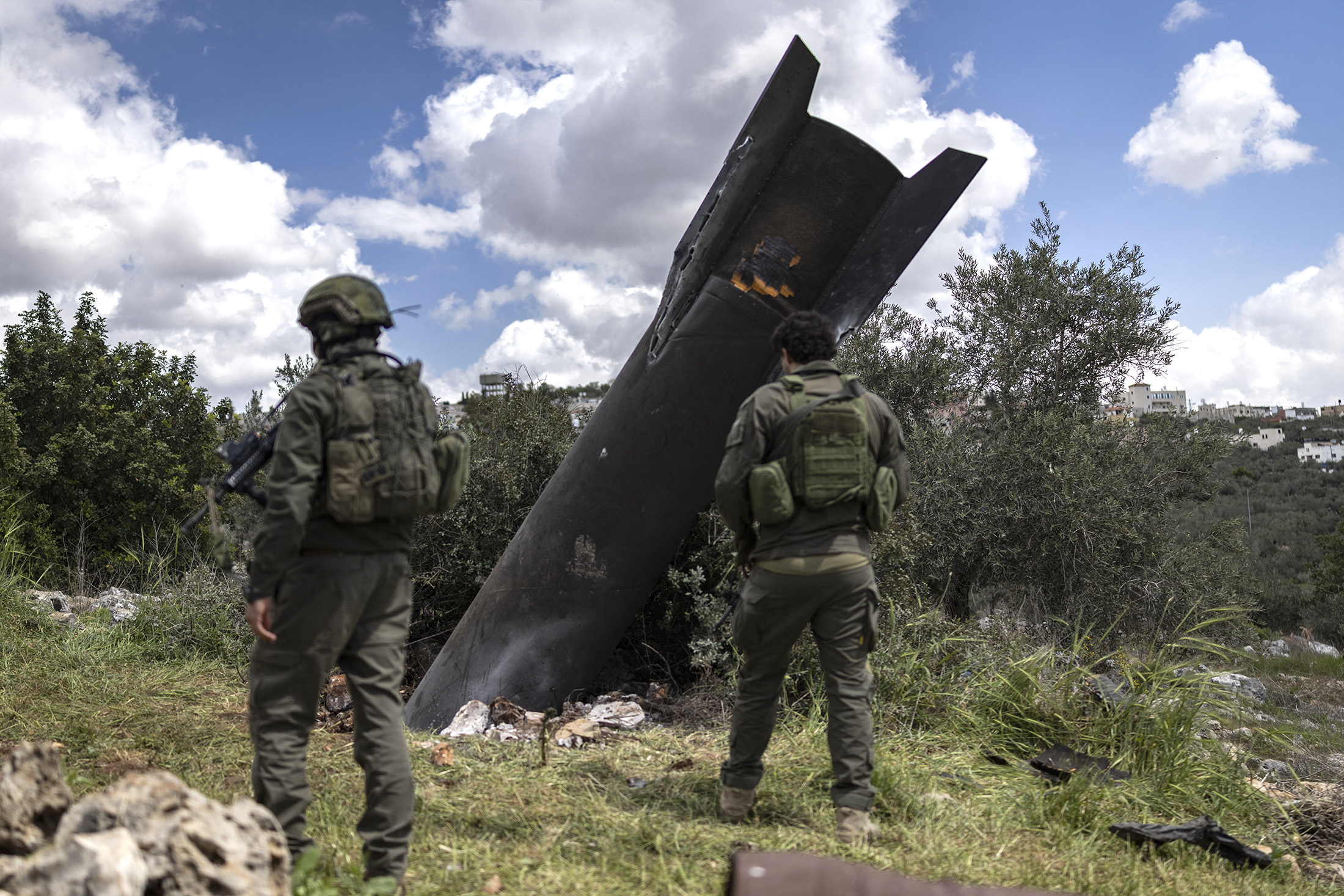 Israeli soldiers arrive to check an Iranian missile remnant that landed in the Israeli-occupied West Bank village of Hares on March 24, 2026. Photographer: Ilia Yefimovich/AFP/Getty Images