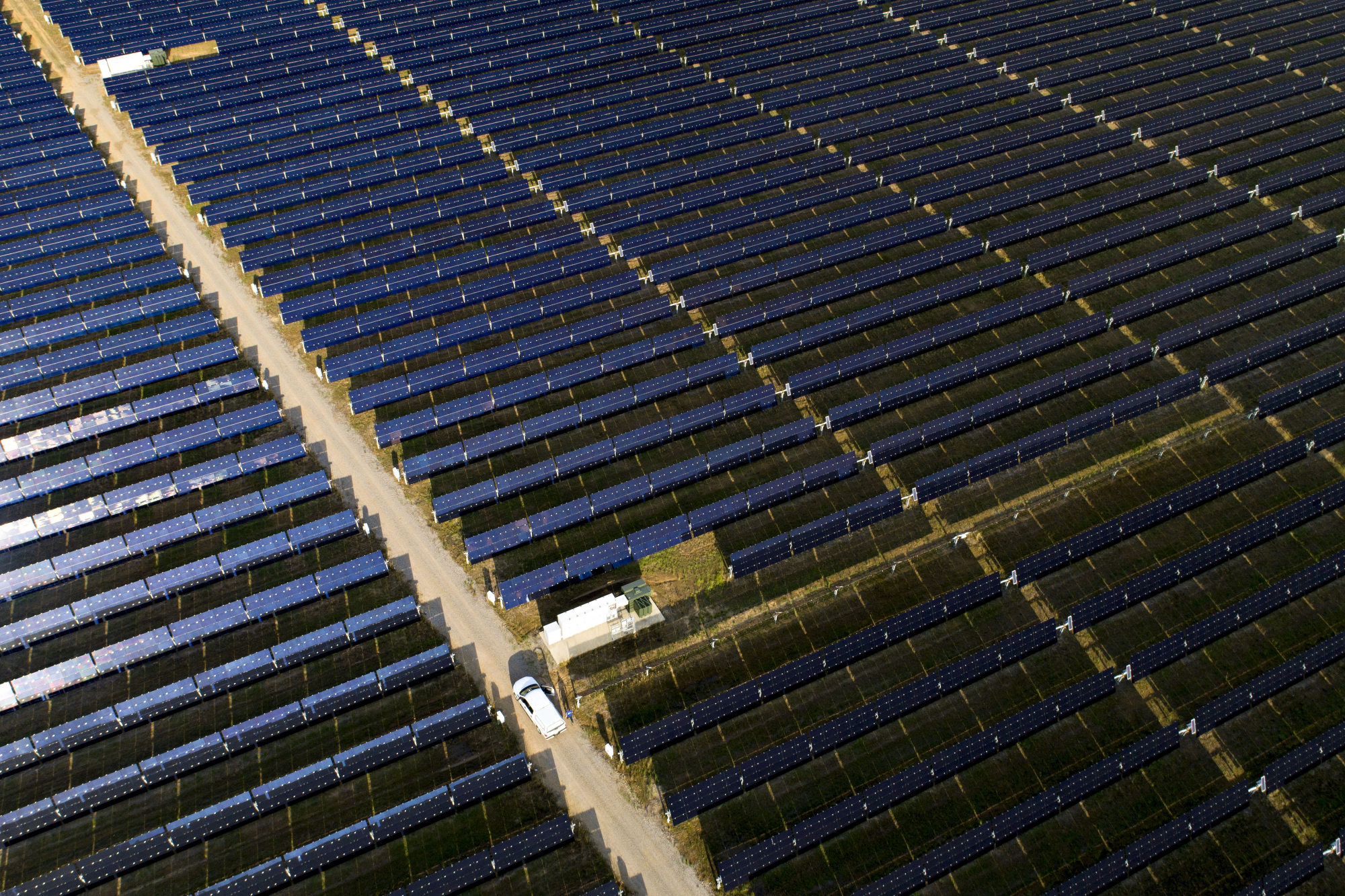 A maintenance vehicle sits amongst solar panels above Selmer, Tennessee, U.S.