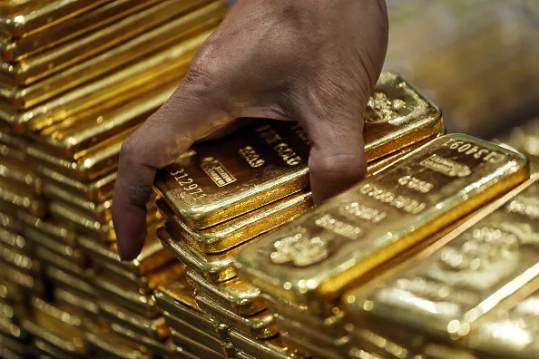 Weighing wealth.
