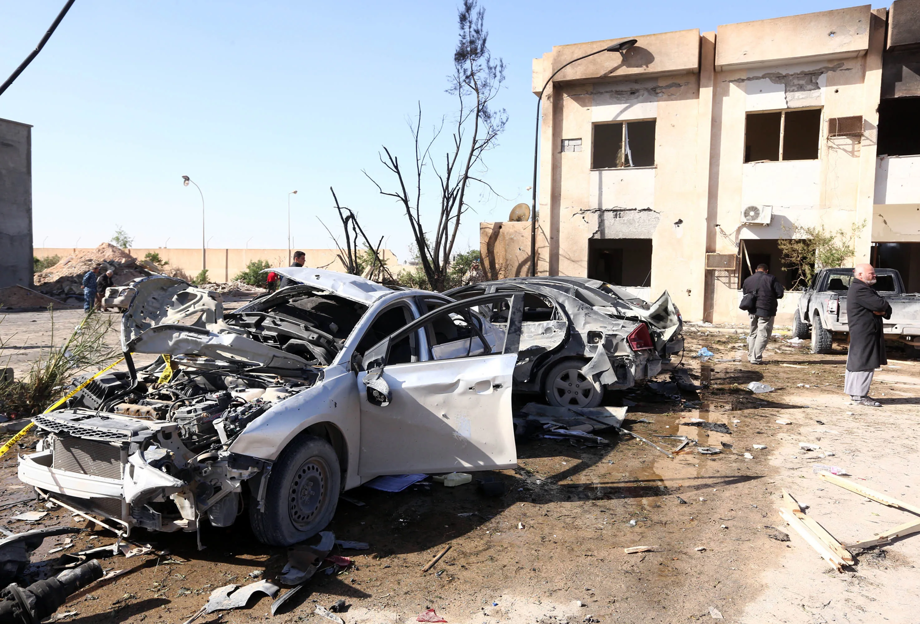 Libyans gather at the site of a suicide truck bombing on a police school in Libya's coastal city of Zliten on Jan 7, 2016.
