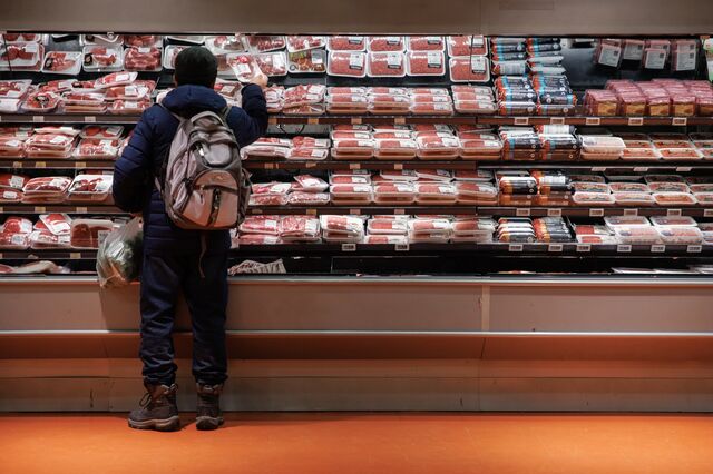 A customer shops for meat at a grocery store in Toronto. 