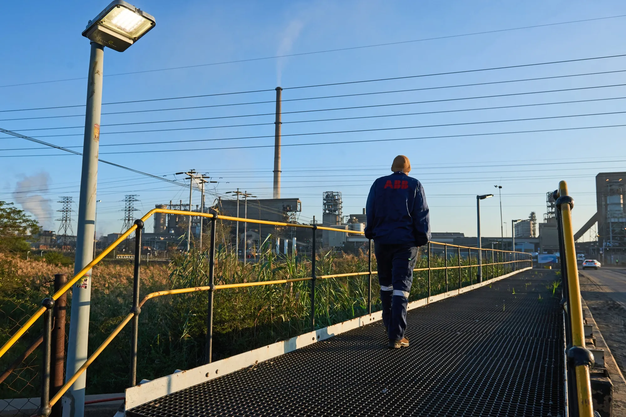 A worker walks towards the Waterval smelter, operated by Anglo American Platinum Ltd., outside Rustenburg, South Africa.
