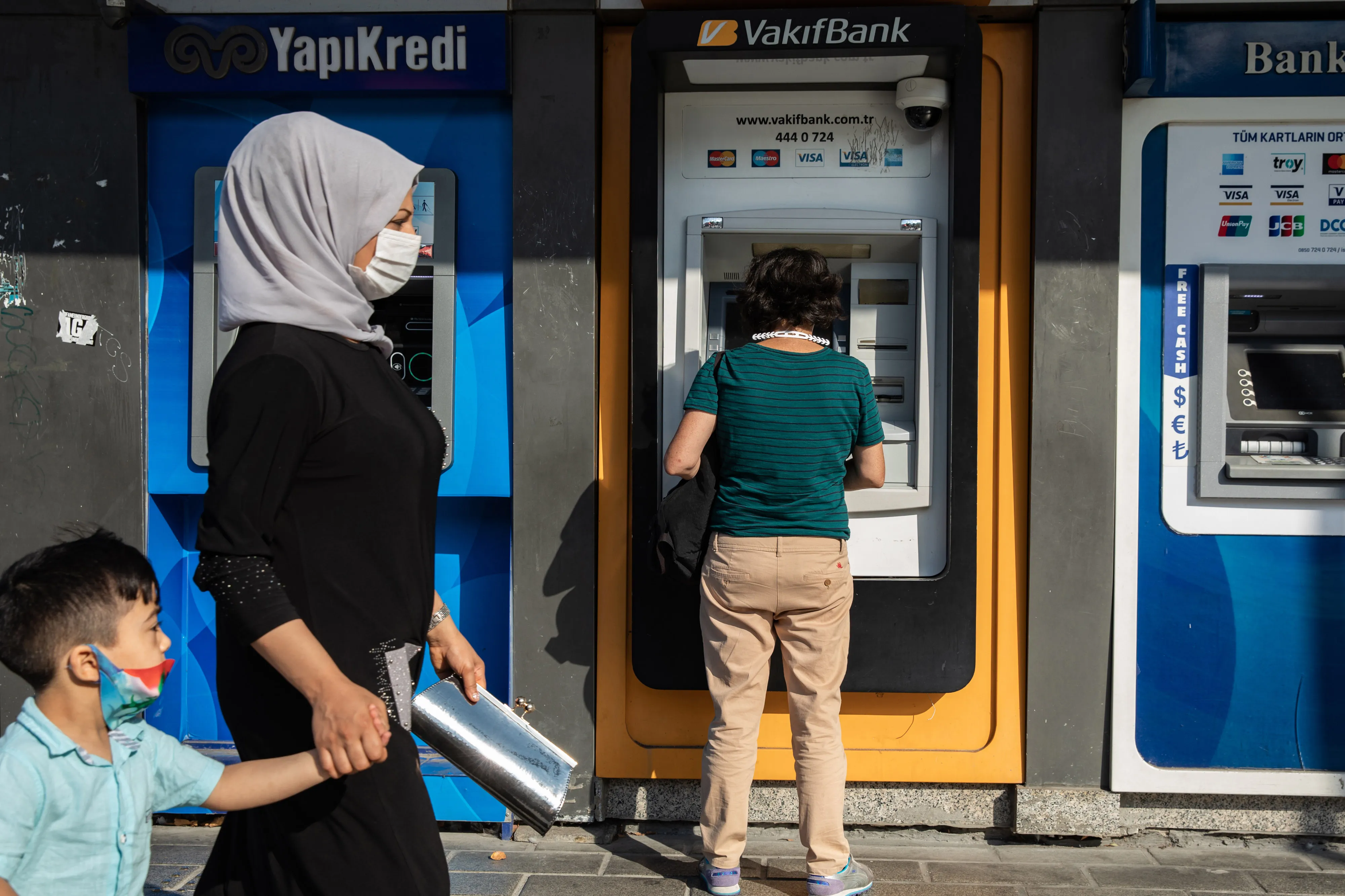 A customer uses an ATM in Istanbul.