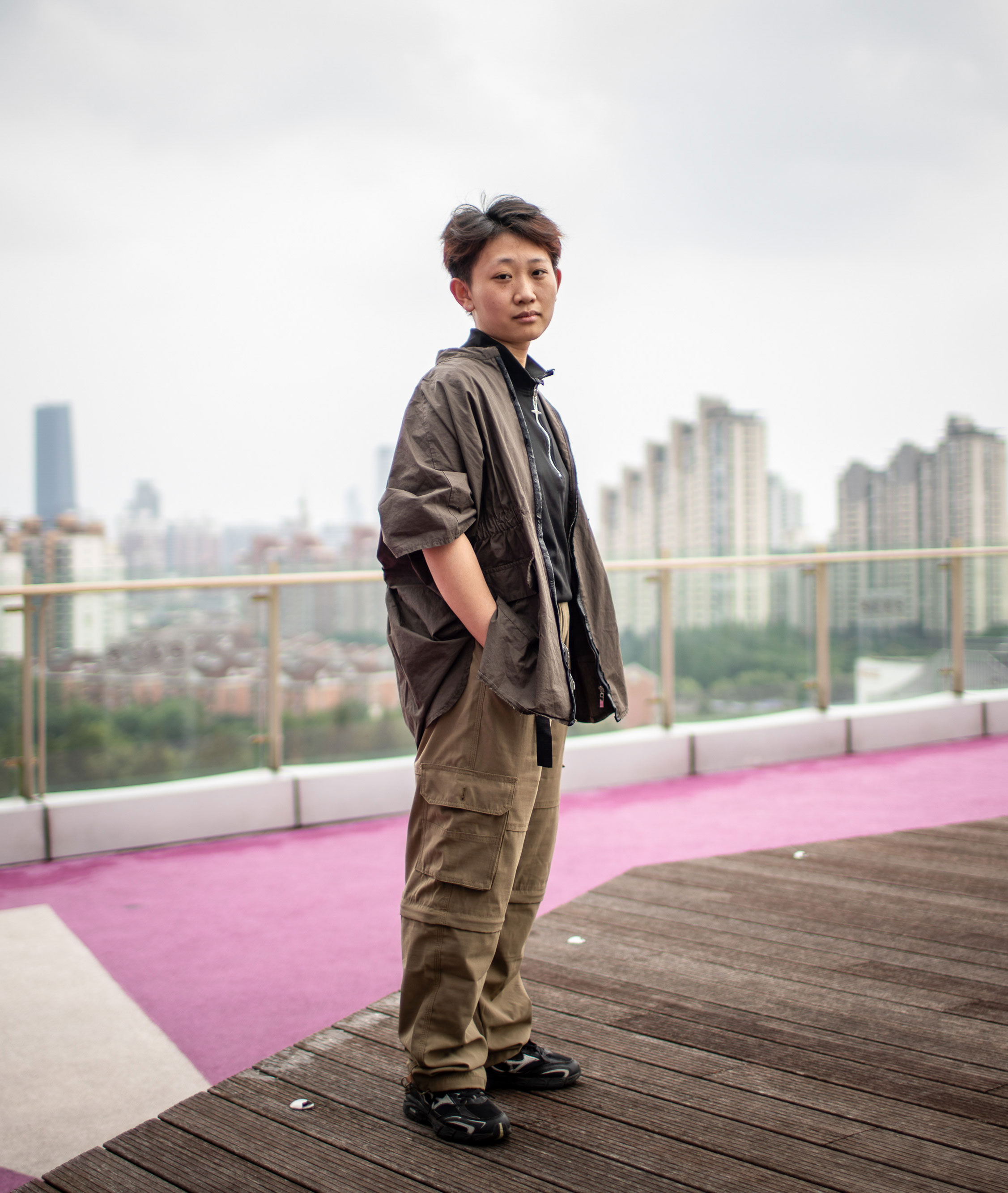 Yang Zhifeng standing on a rooftop of a Shanghai mall.