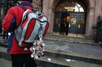 A student stands outside the Trinity School in New York.