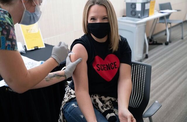 Allison Wynes receives the Covid-19 vaccine.