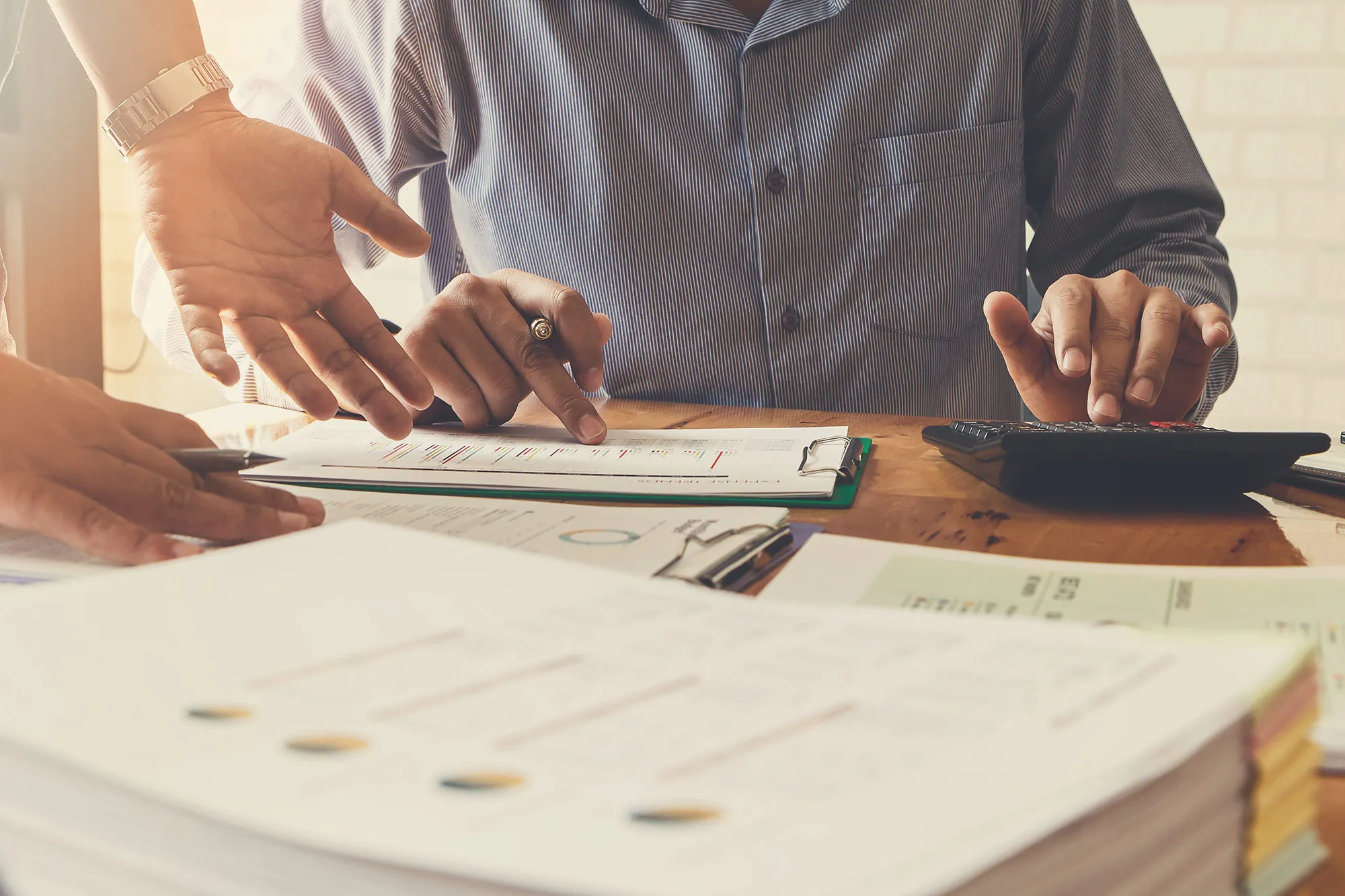 Business team meeting and discussing project plan. Businessmen discussing together in meeting room. Professional investor working with business project together. Finance managers task.