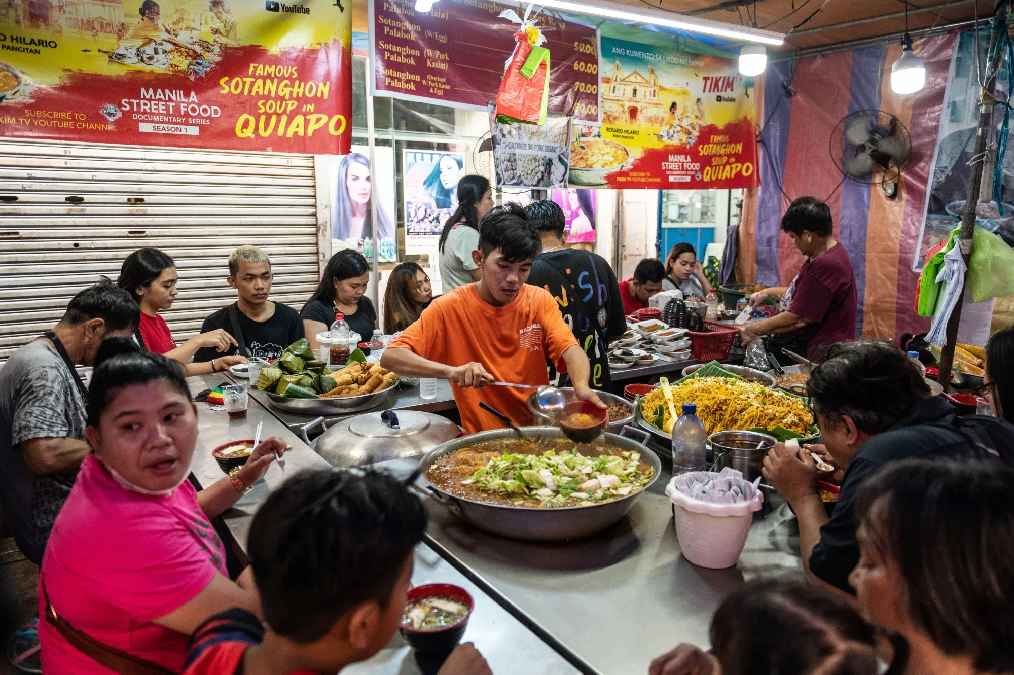 A worker prepares a customer's order at a food stall in Manila, the Philippines.