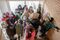 Swedish students walk through a group of refugee children.