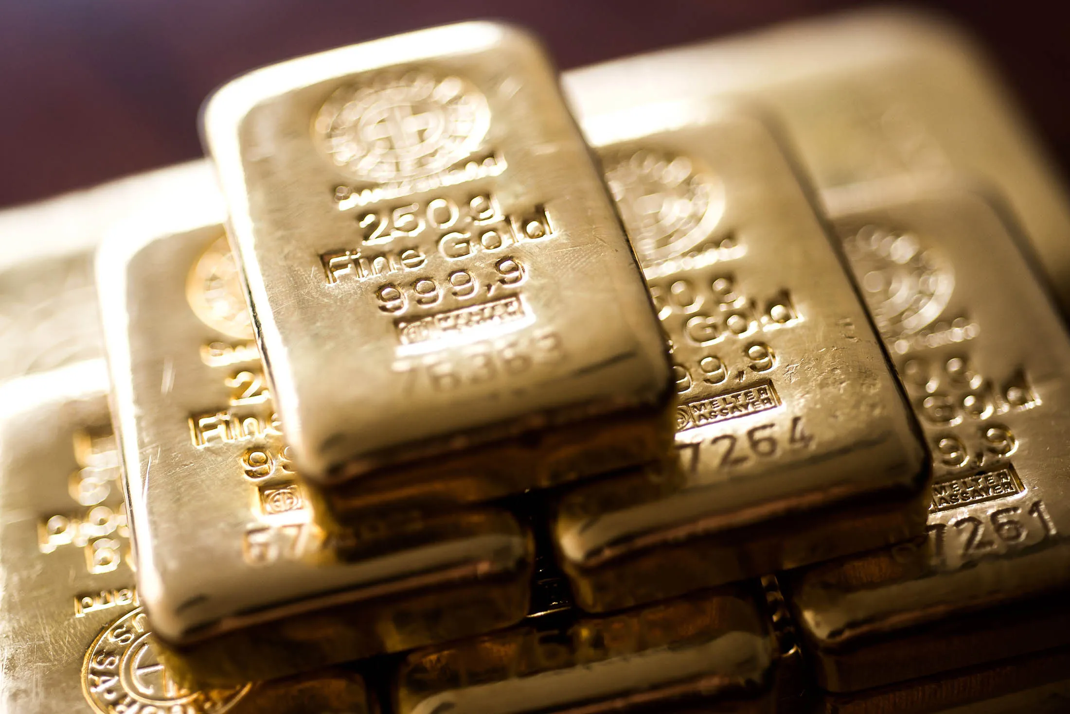 Two hundred and fifty gram gold bars sit stacked in this arranged photograph at Solar Capital Gold Zrt. in Budapest, Hungary, on Thursday, March 10, 2016. Gold advanced to the highest level in a year after the European Central Bank indicated it wouldn't cut interest rates further, boosting the euro and making dollar-denominated bullion less expensive for investors.
