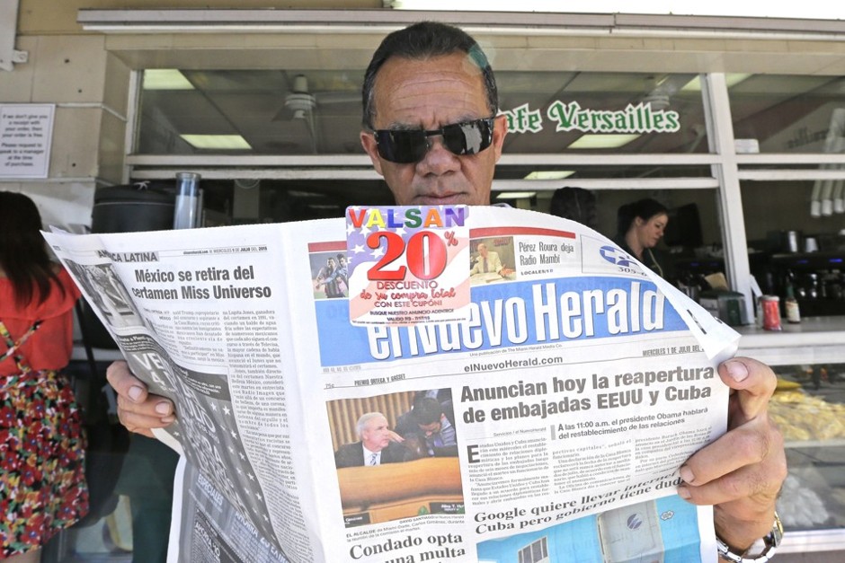  Outside Little Havana's Cafe Versailles, a man reads The Miami Herald's Spanish-language newspaper.