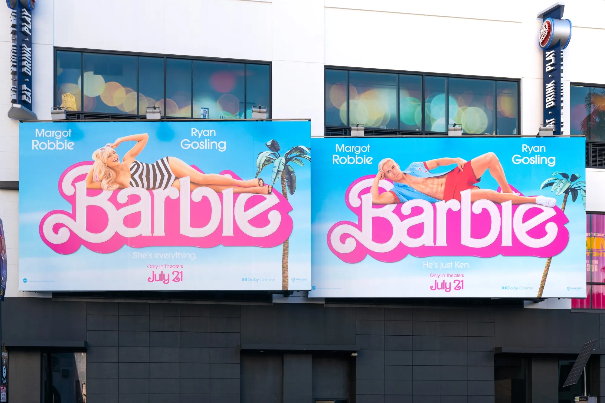 The Barbie movie is advertised on billboards in Hollywood.