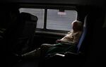 A man sleeps on an Amtrak train near Birmingham, Alabama.