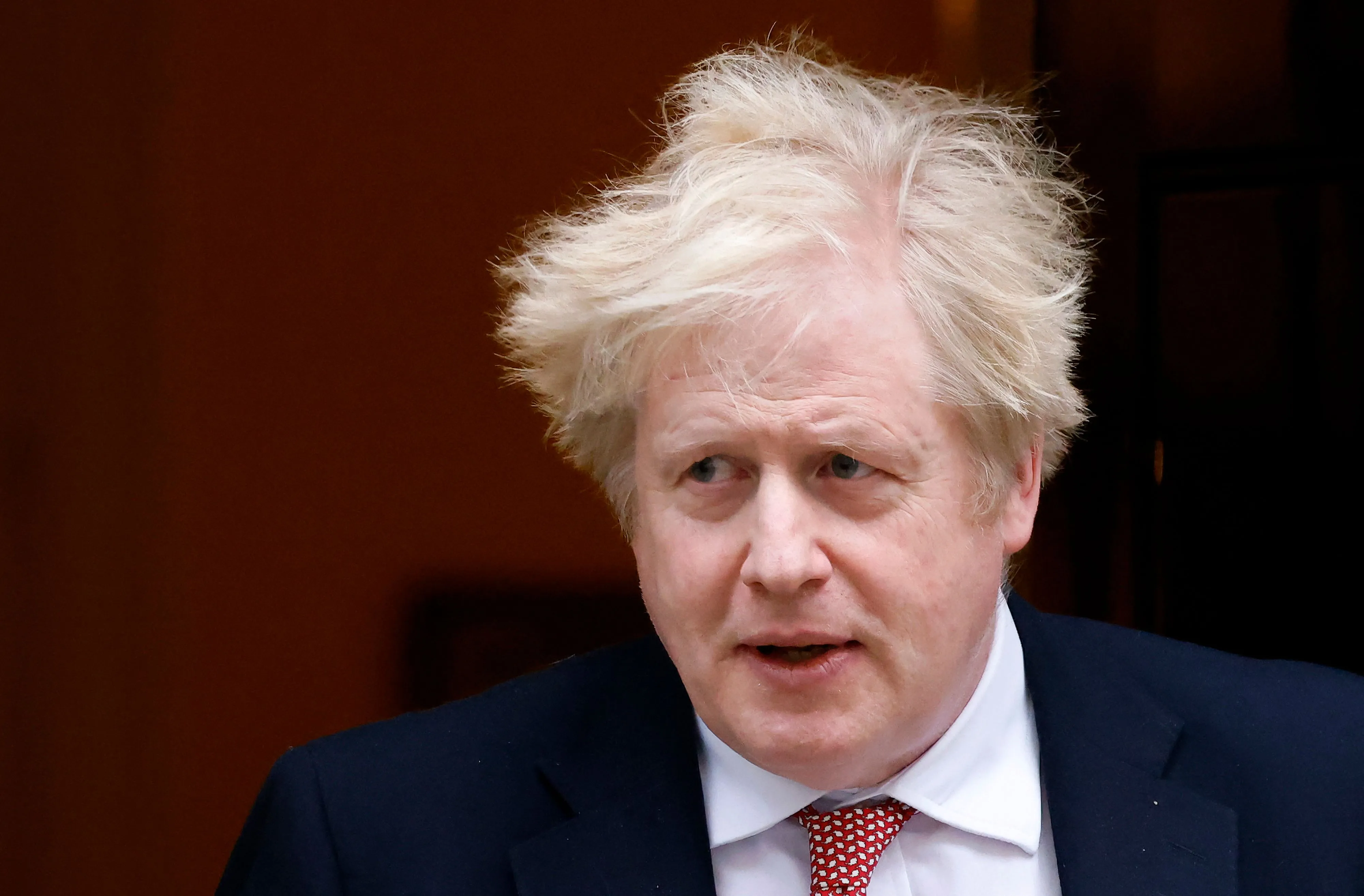 Boris Johnson leaves from 10 Downing Street in central London on Feb. 21.
