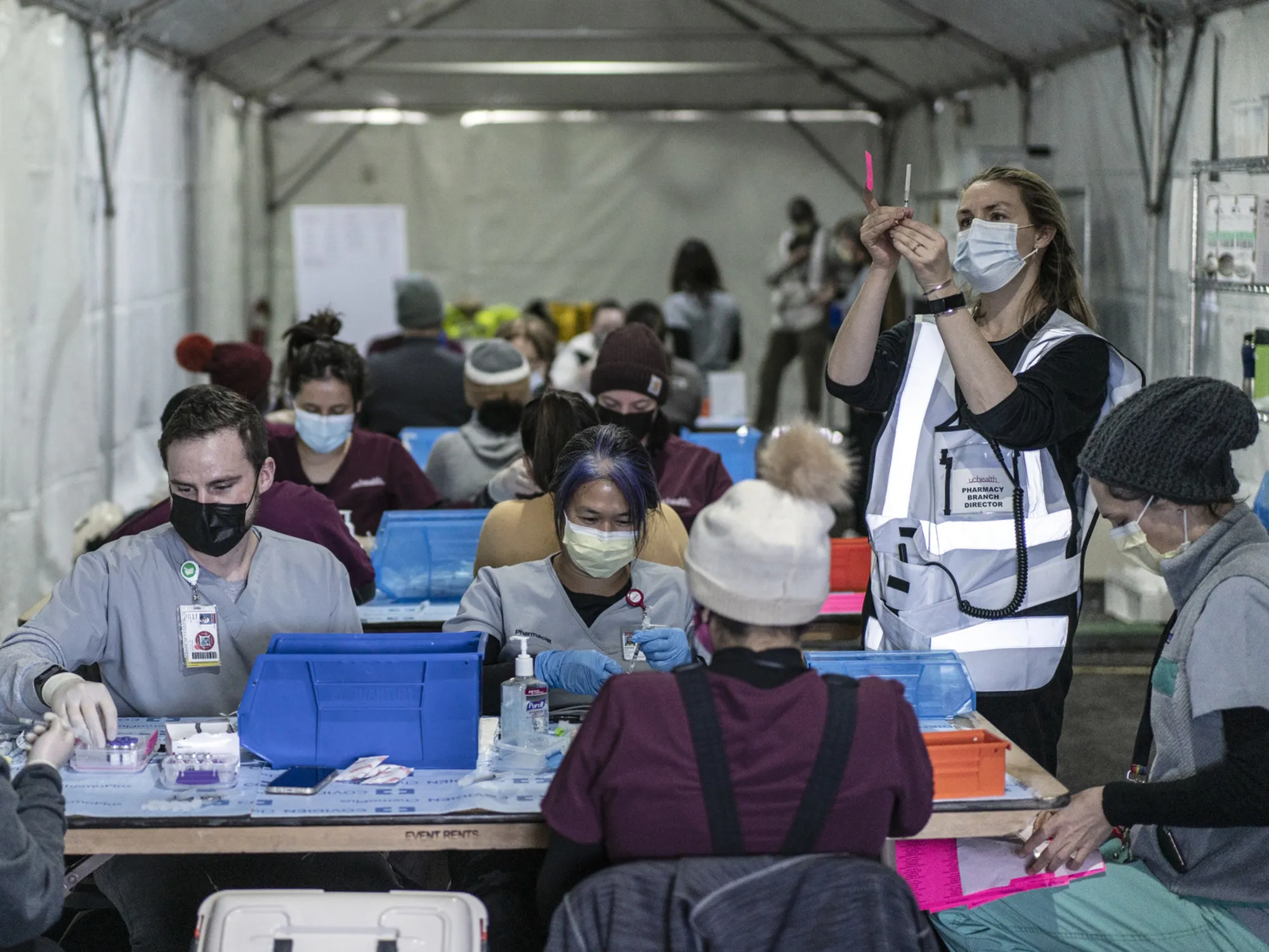 Healthcare workers prepare doses of the Pfizer-BioNTech Covid-19 vaccine at Coors Field in Denver, Colorado, on Feb. 20, 2021.