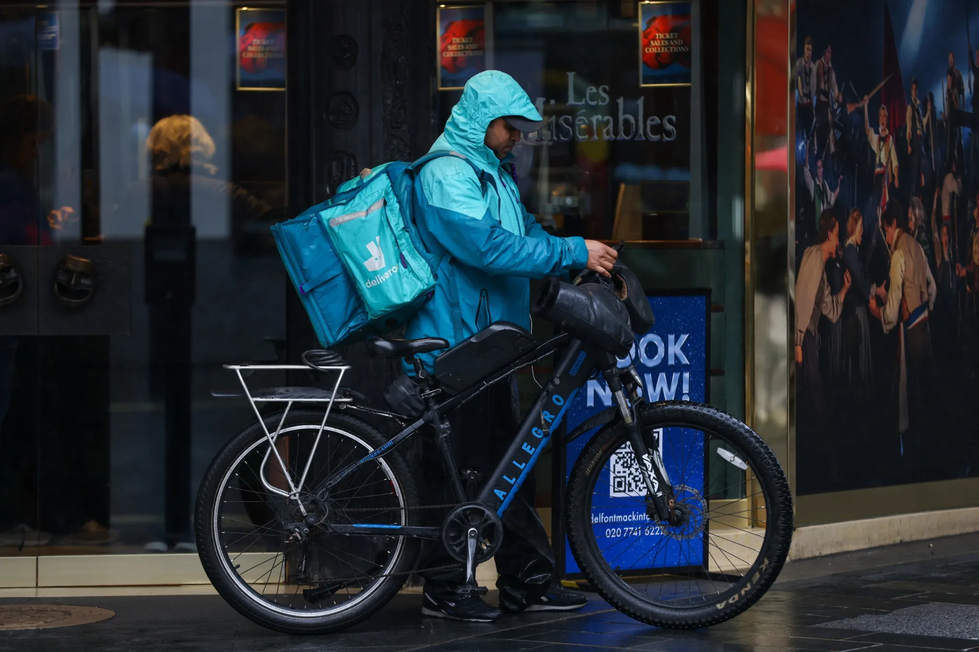 A food delivery courier, working for Deliveroo