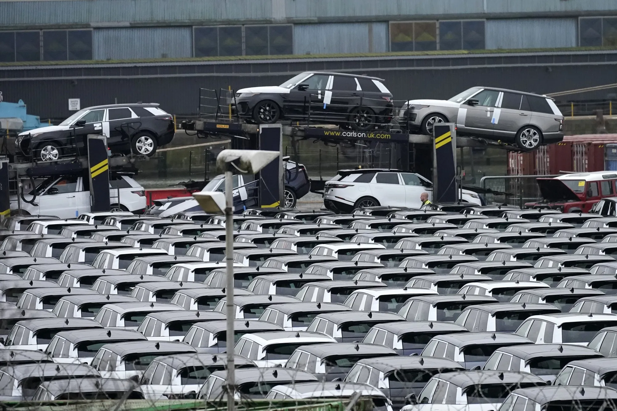 Cars waiting for export on the dockside at The Port of Liverpool.