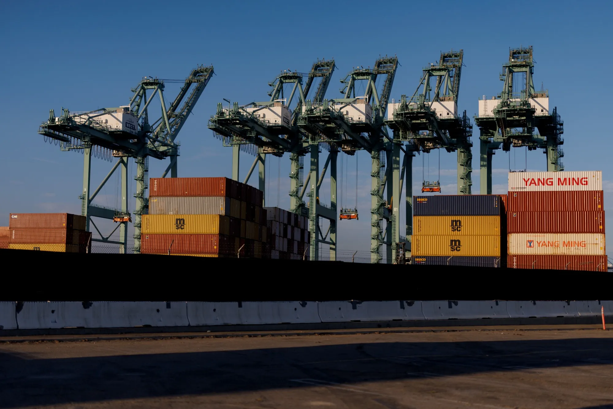 Cranes and shipping containers at the Port of Los Angeles in August.&nbsp;