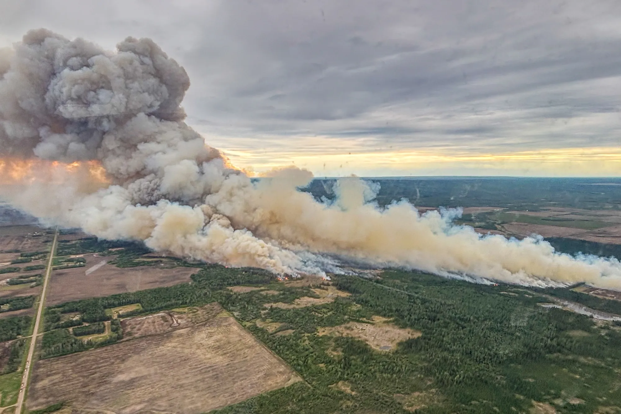A wildfire labeled HWF040 is burning east of La Crete Ferry in Alberta, Canada.
