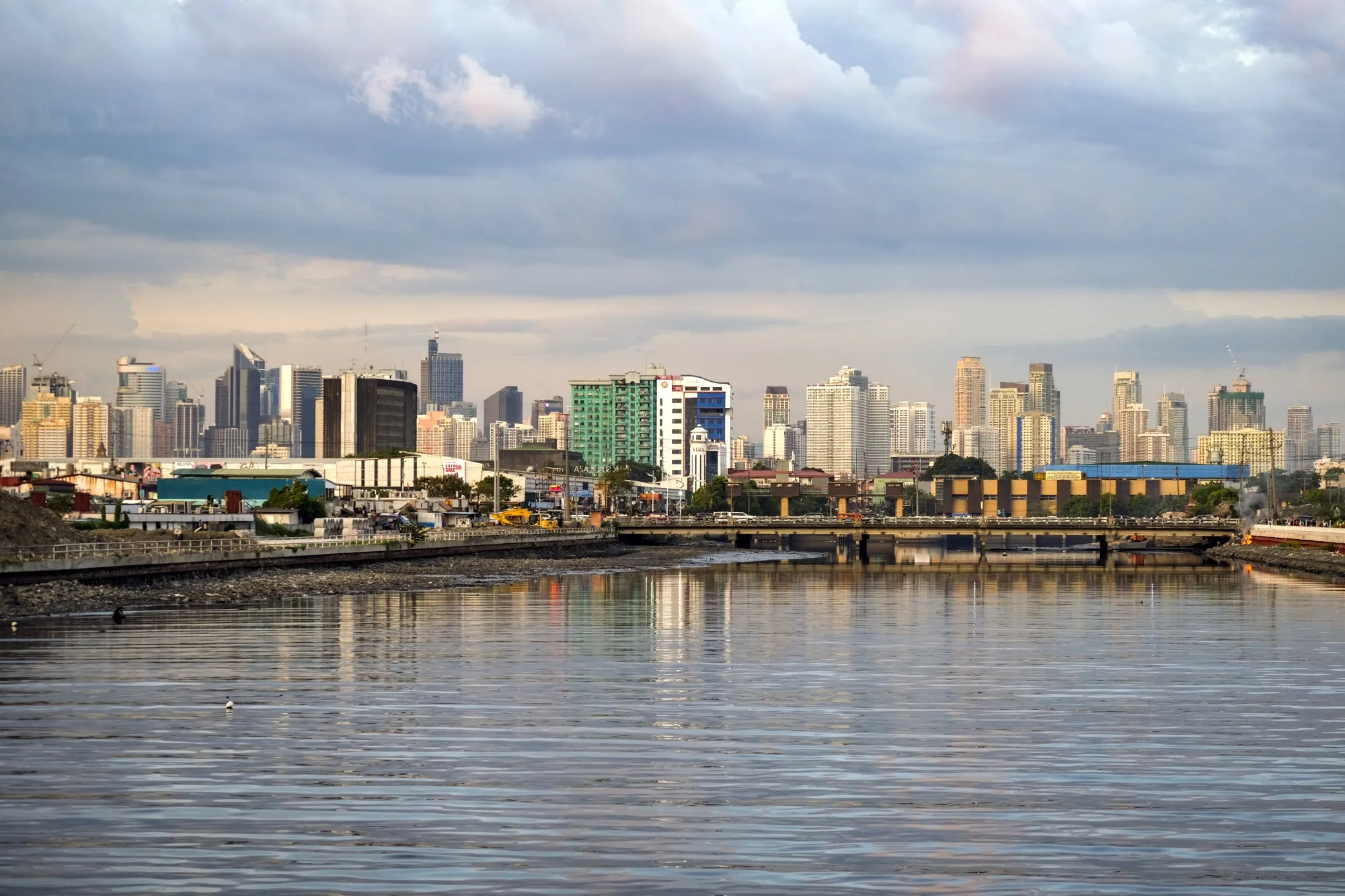 Buildings stand in the Makati district of Manila, the Philippines, on Monday, June 17, 2019. Manila, one of the largest and most congested urban areas in the world, has a solution to its problems: build artificial islands in the sea. Manila’s dilemma is one shared by many fast-growing cities in developing nations. Rapid growth in population⁠—boosted by migration from rural areas⁠—is overwhelming services, roads, transportation, power and drainage.