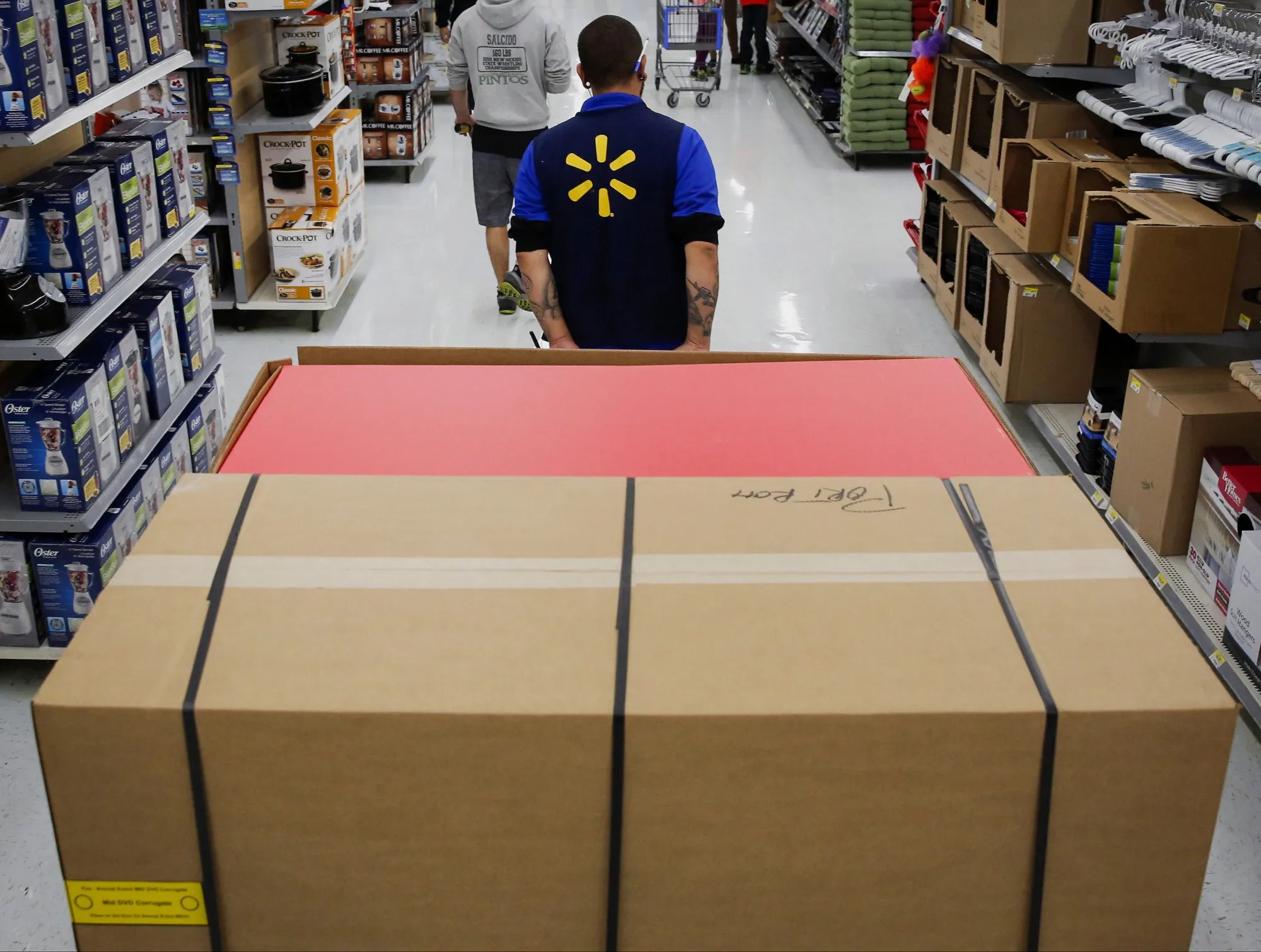 An employee pulls a forklift at a Wal-Mart store in Los Angeles.
