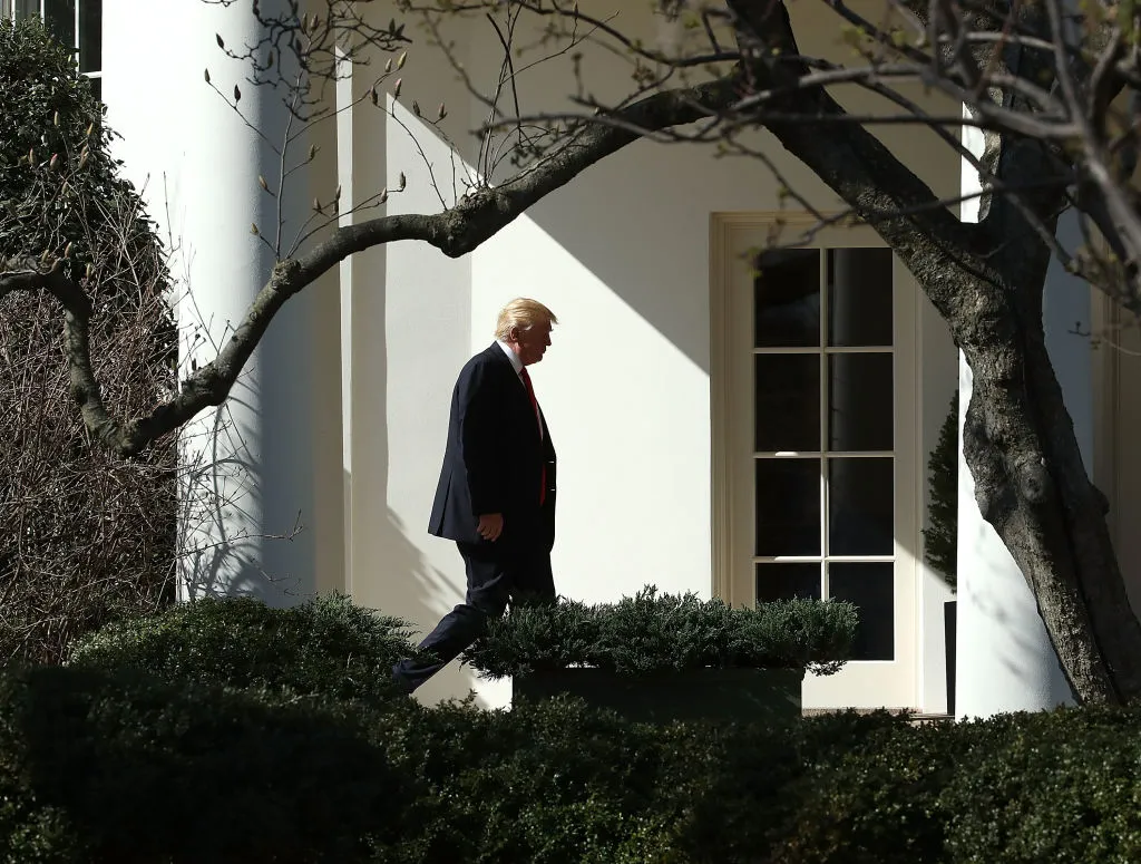 Donald Trump walks to the Oval Office.