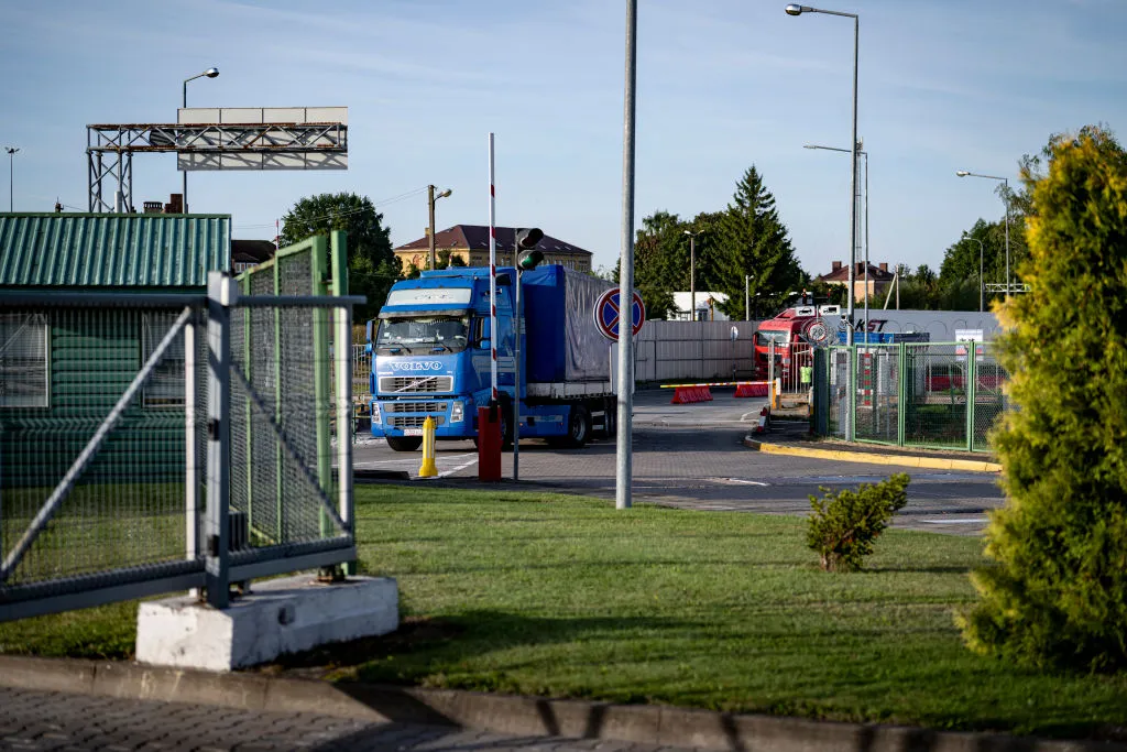 Trucks drive across the border crossing between Russia and&nbsp;Lithuania.