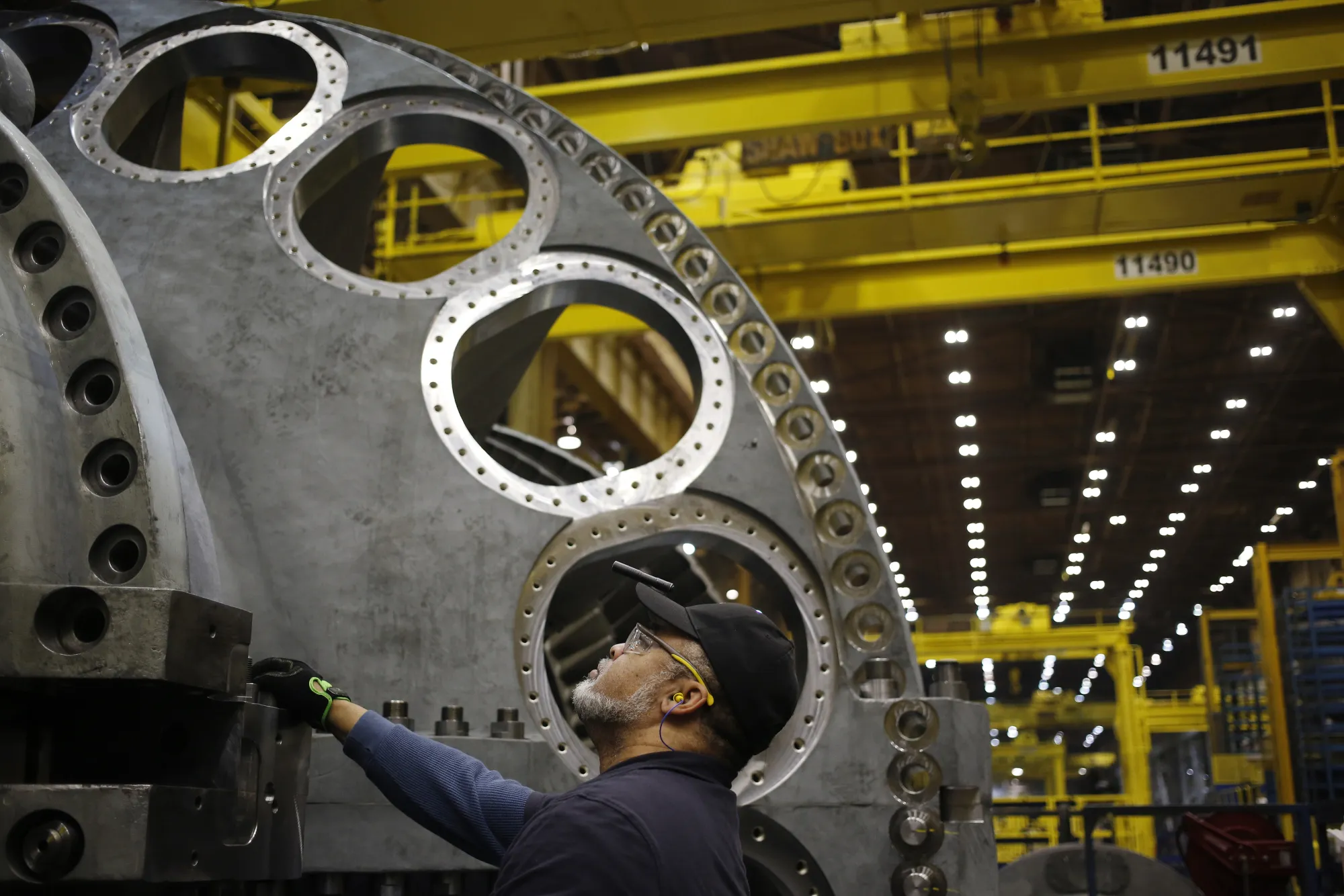 A worker stands on the assembly line for gas turbines at the GE&nbsp;plant in Greenville, South Carolina.