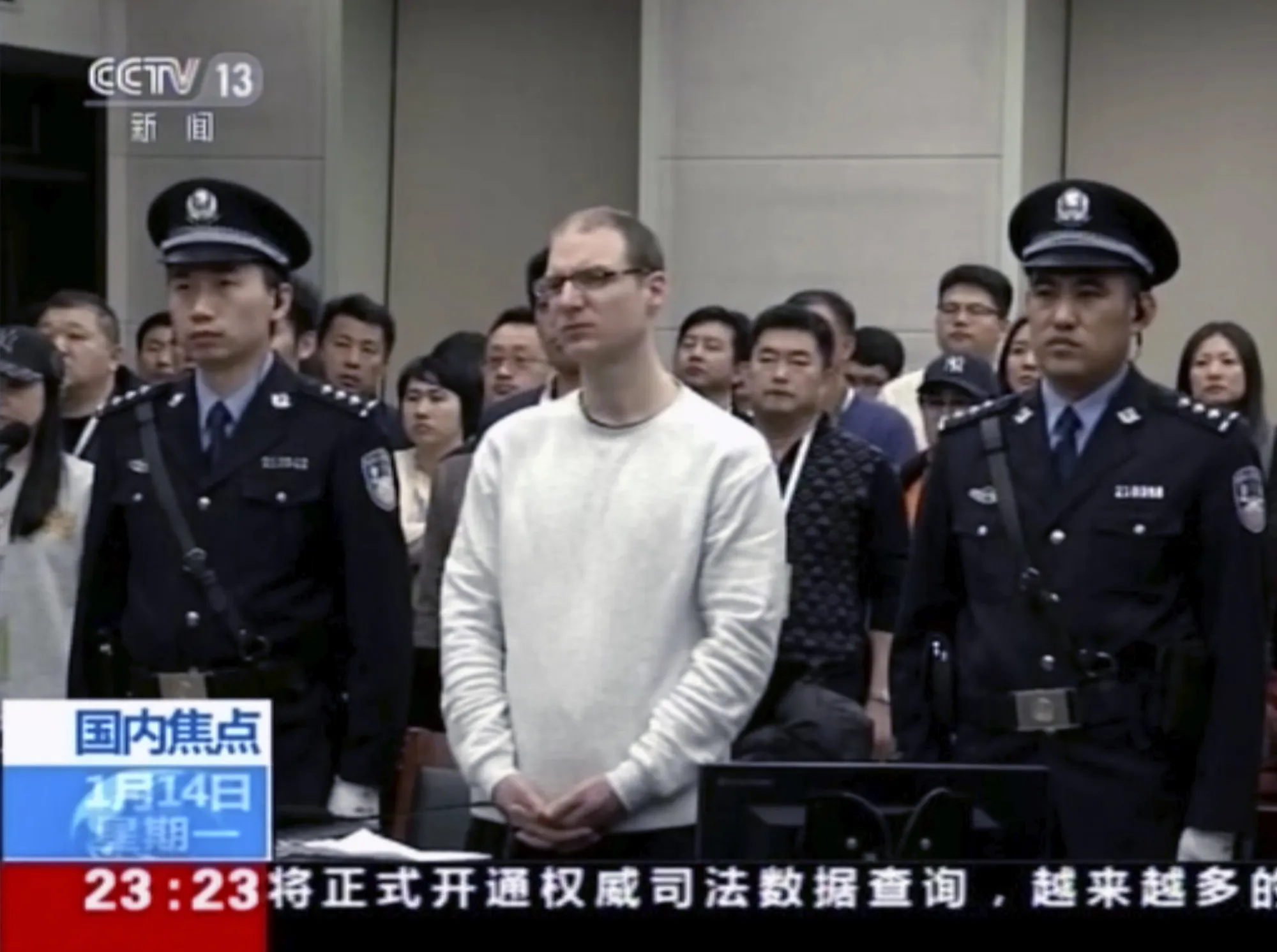 Robert Lloyd Schellenberg attends his retrial at the Dalian Intermediate People’s Court in Dalian, China, in this 2019 video footage run by China’s CCTV.