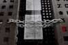 A chain secures locked gates in front of a shuttered store in Madrid, Spain, on Thursday, May 7, 2020. Italy and Spain, the two European countries most severely hit by the coronavirus, are suffering even deeper slumps after record contractions in the first quarter.