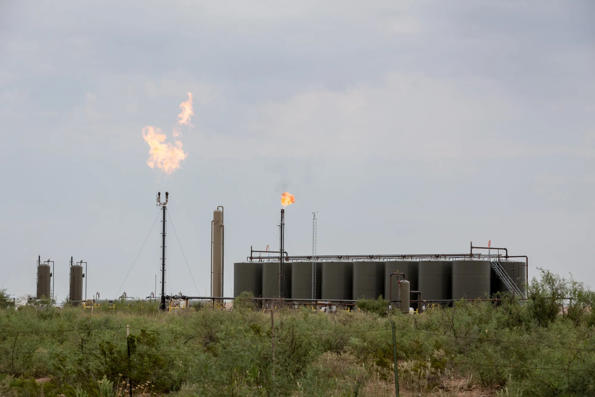 Methane gas is flared just off U.S. Route 285 near Carlsbad, New Mexico, U.S., on Tuesday, Aug. 6. 2019.&nbsp;