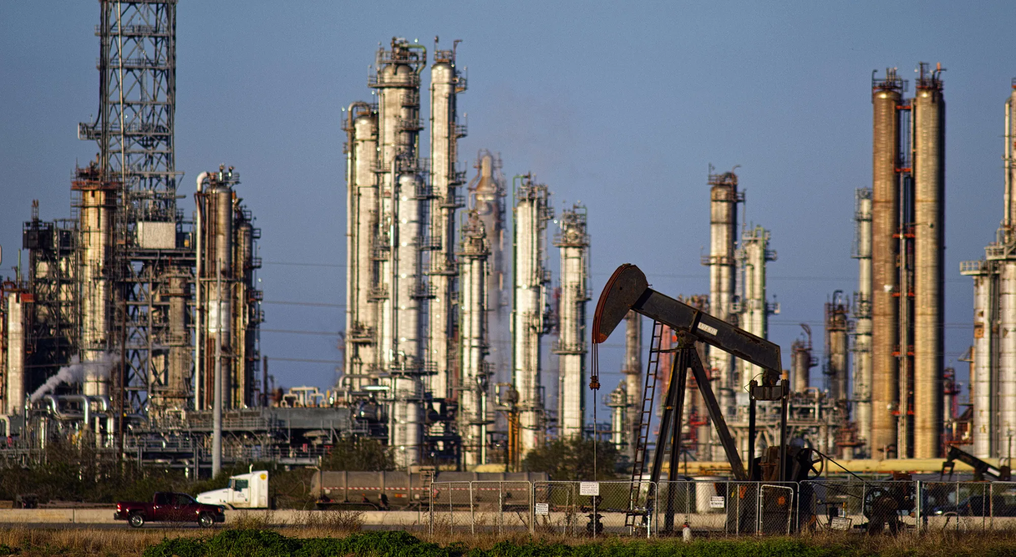 Views Of Tankers & Refineries As Oil Trades Near 12-Year Low