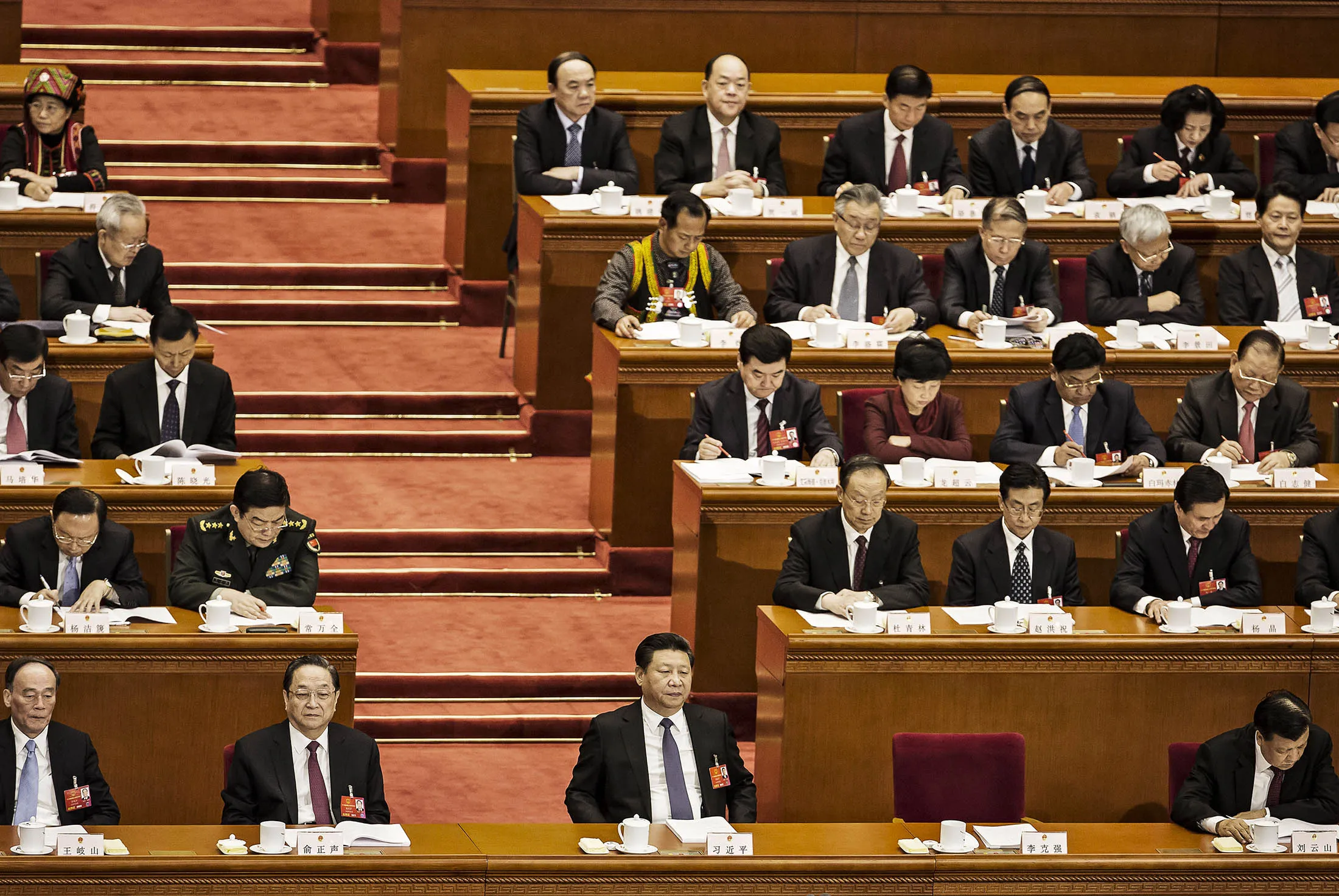 Xi Jinping and other delegates at the opening of the fourth session of the 12th National People's Congress.
