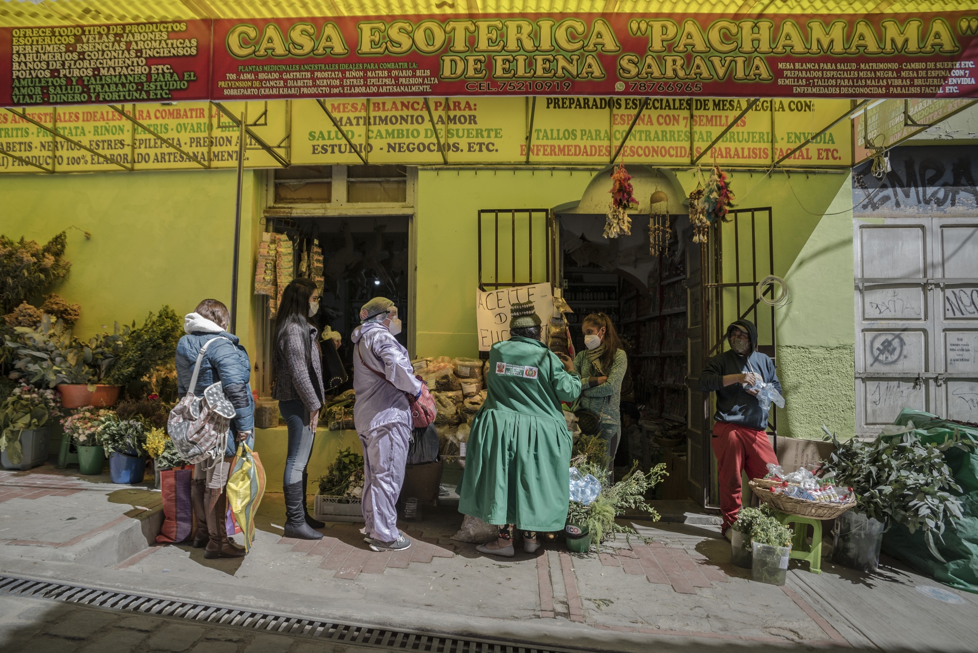 People shop for herbs to use as a preventive measure against Coronavirus in La Paz, Bolivia.