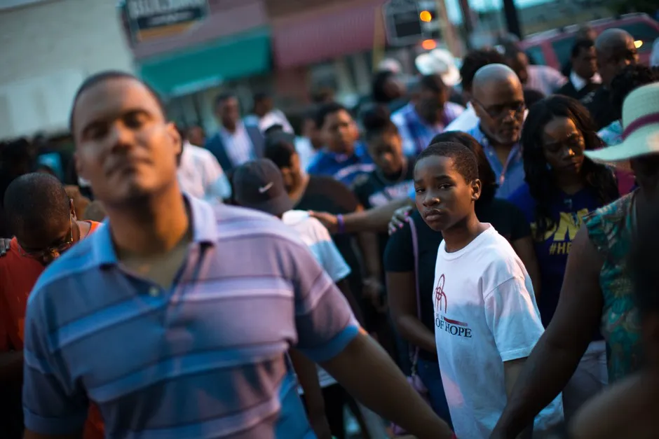 A young boy stands at a Black Lives Matter prayer vigil on the steps of the First Baptist Church, a predominantly African-American congregation, in Macon, Georgia.